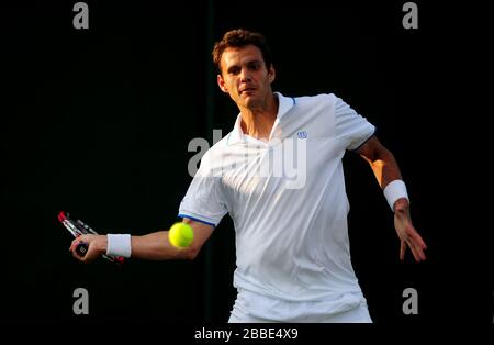France's Paul-Henri Mathieu in action against Lithuania's Ricardas Berankis Stock Photo