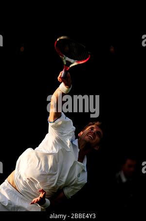 France's Paul-Henri Mathieu in action against Lithuania's Ricardas Berankis Stock Photo