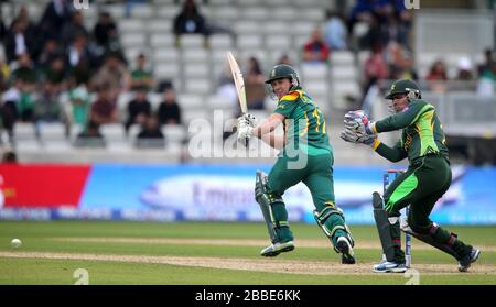 South Africa batsman AB de Villiers scores runs watched by Pakistan wicketkeeper Kamran Akmal Stock Photo