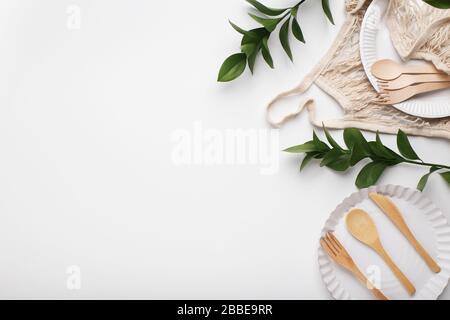 Set of cutlery made of wood on paper dishes Stock Photo