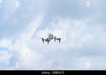 professional drone with camera in the air Stock Photo