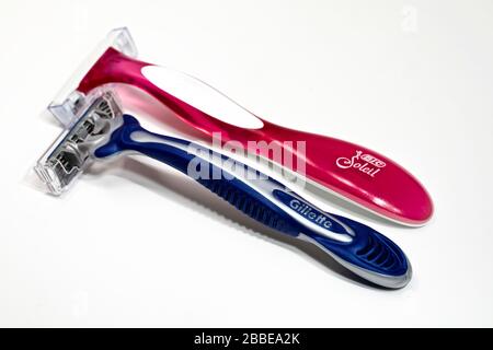His & Her Disposable Razors on a white background Stock Photo