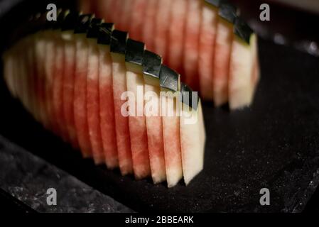 Slices of delicious, refreshing and healthy watermelon on a black plate Stock Photo