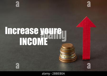 Increase your income. Money bag and up drawn chart. Increase of salary or income. Copy space, dark background. Stock Photo