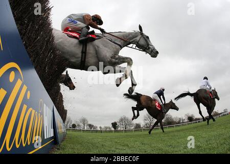 Jumping action during the Betfred Peterborough Chase at Huntingdon Racecourse, Brampton, Cambridgeshire Stock Photo