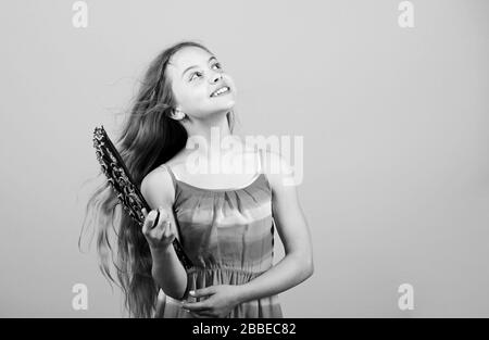 Handheld fan create airflow. Airflow from handfans increases evaporation. Cooling effect. Folding fans. Acting school. Dances with fan. Girl fanning herself with fan. Air circulation. Art and culture. Stock Photo