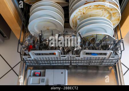 Dishwasher, full of dirty dishes, cleaning rod, Stock Photo