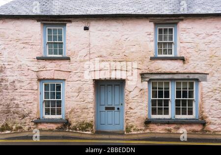 Old painted stone wall cottage in need of decoration located in Newport, Pembrokeshire. Wales. UK Stock Photo