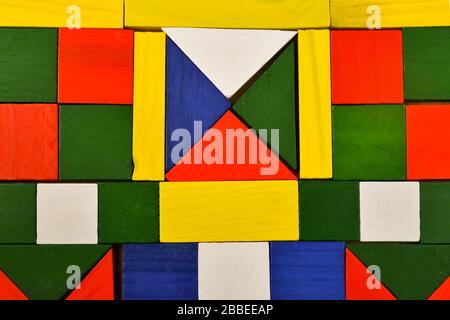Children s designer of bright wooden multi-colored parts background Stock Photo