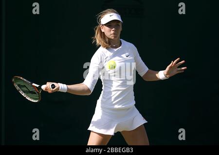 Great Britain's Katie Boulter in action in her match against Croatia's Adrijana Lekaj during day six of the Wimbledon Championships at The All England Lawn Tennis and Croquet Club, Wimbledon. Stock Photo