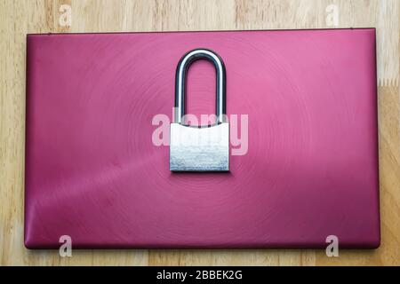 The silver padlock on laptop. The computer is cyber security. Stock Photo