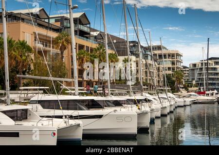 South Africa, Western Cape, Cape Town, Victoria and Alfred Waterfront, luxury social leisure craft moored outside, expensive waterside housing Stock Photo