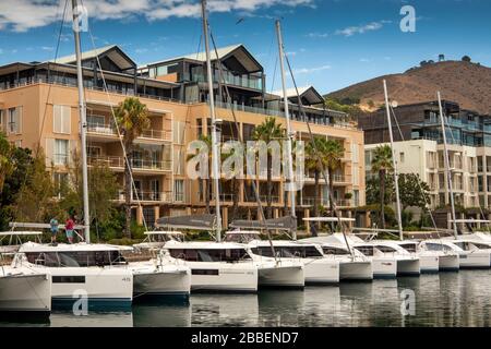 South Africa, Western Cape, Cape Town, Victoria and Alfred Waterfront, luxury social leisure craft moored outside, expensive waterside housing Stock Photo