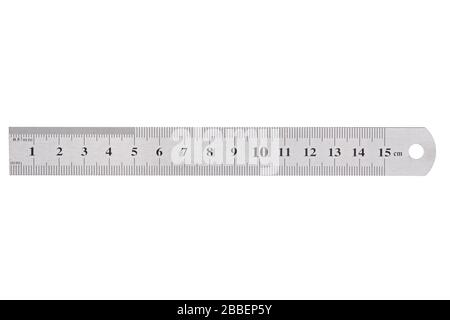 A metal ruler with a scale of up to 15 centimeters is isolated on a white background. Stock Photo