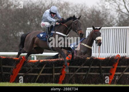 Race winner Miss Ballantyne ridden by Barry Geraghty in jumping action in the racinguk.com Mares Novices Hurdle Stock Photo