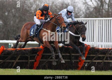 Race winner Miss Ballantyne ridden by Barry Geraghty (R) and Floral Spinner ridden by Chris Davies in jumping action in the racinguk.com Mares Novices Stock Photo