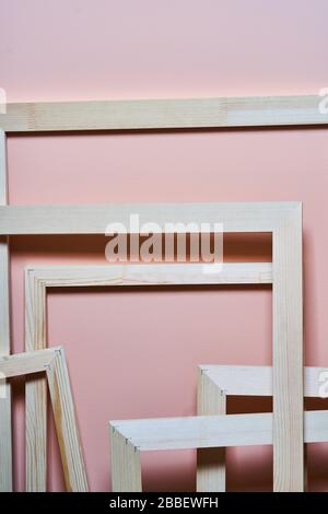 Wooden frames on a pink background. Frames for photos and paintings Stock Photo