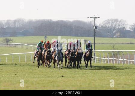 General view of horses racing at Folkestone Racecourse, Westenhanger, Kent Stock Photo