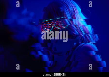 Girl with blaster in the futuristic battle. Concept virtual reality, cyber game and science fiction. Image with glitch effect. Stock Photo