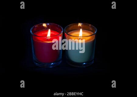 Lite Candles against a black background taken using candle light and a small torch, Northampton, England, UK. Stock Photo