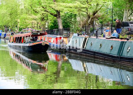 A narrow boat (canal boat) goes up the River Thames in Little Venice in London, England. Stock Photo