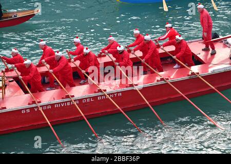 Venice, Italy-February 2020; high angle view of the Festa Veneziane on the Water with floating structures and people in boats in costumes at part of t Stock Photo