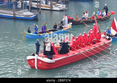 Venice, Italy-February 2020; high angle view of the Festa Veneziane on the Water with floating structures and people in boats in costumes at part of t Stock Photo