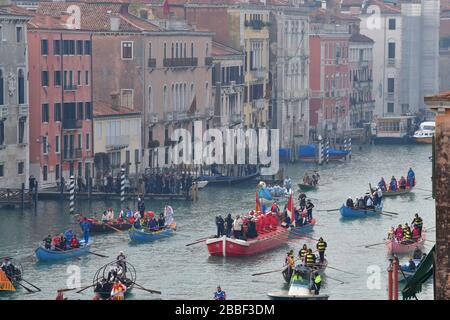 Venice, Italy-February 2020; High angle overview of the Festa Veneziane on the Water with floating structures and people in boats in costumes at part Stock Photo