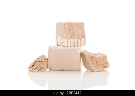 Fresh pressed yeast blocks isolated on white background. Stock Photo