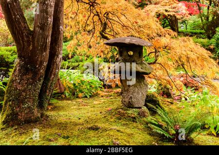 A Japanese lantern in the Japanese Garden at Butchart Gardens in Victoria, British Columbia. Stock Photo