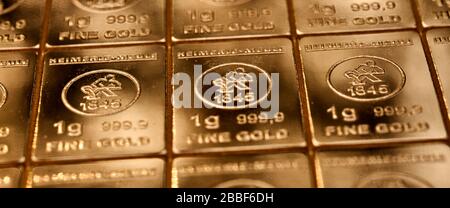 Close-up of a table of 1-gram pieces of 999 pure fine gold, Stock Photo