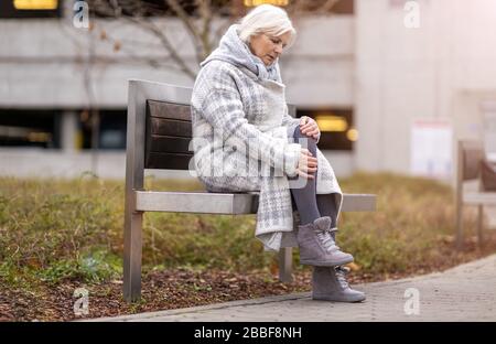 Senior Woman Suffering From Pain Stock Photo