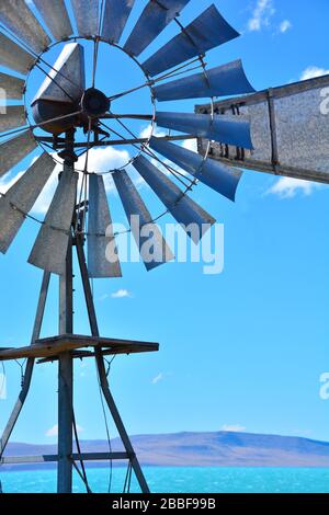 Close up view the blades of an agricultural metal windmill located on Lake Argentina near El Calafate Stock Photo