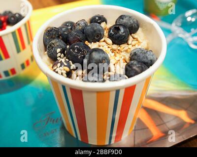 Leon's London porridge with yogurt, blueberries, seeds, healthy breakfast in a British fast food - London Stock Photo