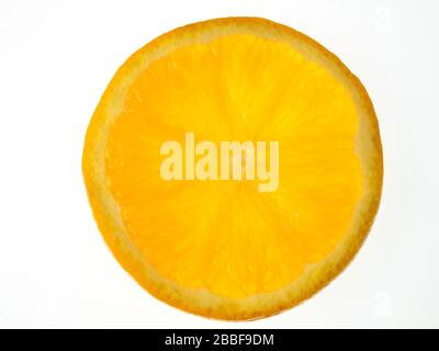 A single slice of orange on a white background Stock Photo