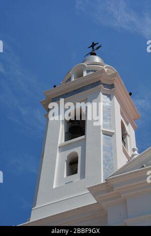 Buenos Aires, Argentina-February 2019: low angle view of the bell tower of Claustros Historicos Basilica del Pilar next to Recoleta cemetery Stock Photo