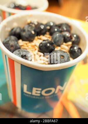 Leon's London porridge with yogurt, blueberries, seeds, healthy breakfast in a British fast food - London Stock Photo