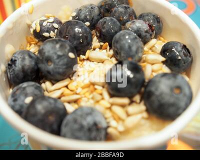 Leon's London porridge with yogurt, blueberries, seeds, healthy breakfast in a British fast food - London Stock Photo