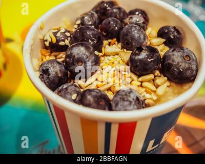 Leon's London porridge with yogurt, blueberries, seeds, healthy breakfast in a British fast food - London Stock Photo