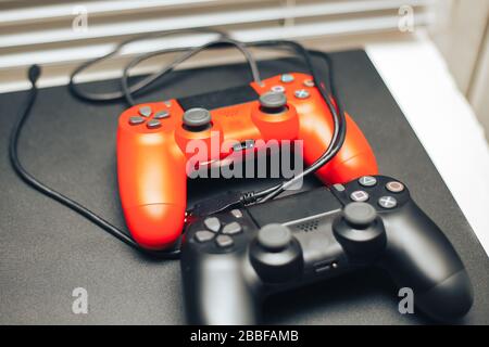 Computer game competition. Gaming concept. red and black joysticks on black background Stock Photo