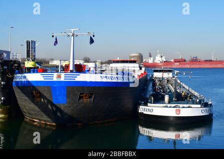 Front view of two docked inland tankers for Chemical and Oil Products in the 7th petroleum harbor with a tank f Stock Photo