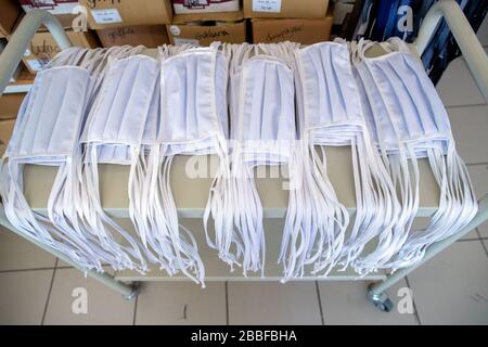 Wendisch Waren, Germany. 31st Mar, 2020. Mouth masks for protection against corona viruses are on a transport trolley at Ber-Bek. The company normally produces chef's jackets and clothing for restaurant kitchens and switched production to protective masks a few days ago. Masks of different sizes and colours are sewn according to customer orders. Credit: Jens Büttner/dpa-Zentralbild/dpa/Alamy Live News Stock Photo