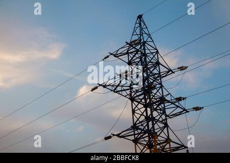 High-voltage networks, against the evening sky Stock Photo