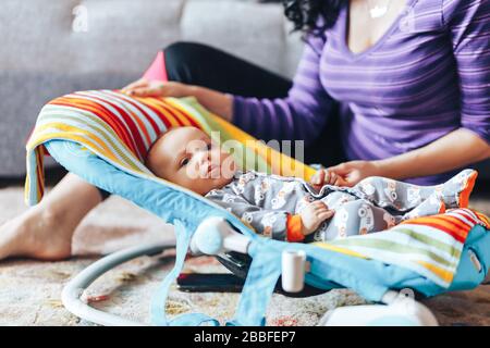 beautiful mother with newborn cute baby at home Stock Photo