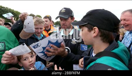 Surrey's Ricky Ponting signs autographs for fans after the game Stock