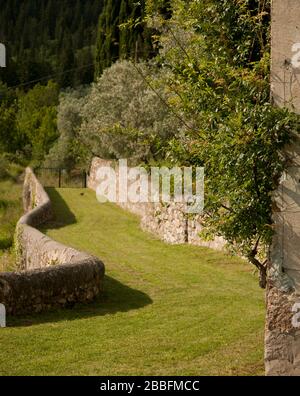 garden and historic villa in hilly Tuscan landscape, Tuscany Italy Stock Photo