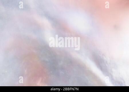 Abstract cloudy blur texture pearl background with shimmering hues of mauve, peach and ocean blue colors Stock Photo