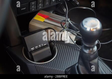 Charging camera batteries in a car Stock Photo