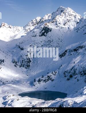 The mountains of Tartano Valley, near the town of Morbegno, Italy, during a beautiful winter day Stock Photo