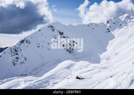 The mountains of Tartano Valley, near the town of Morbegno, Italy, during a beautiful winter day Stock Photo